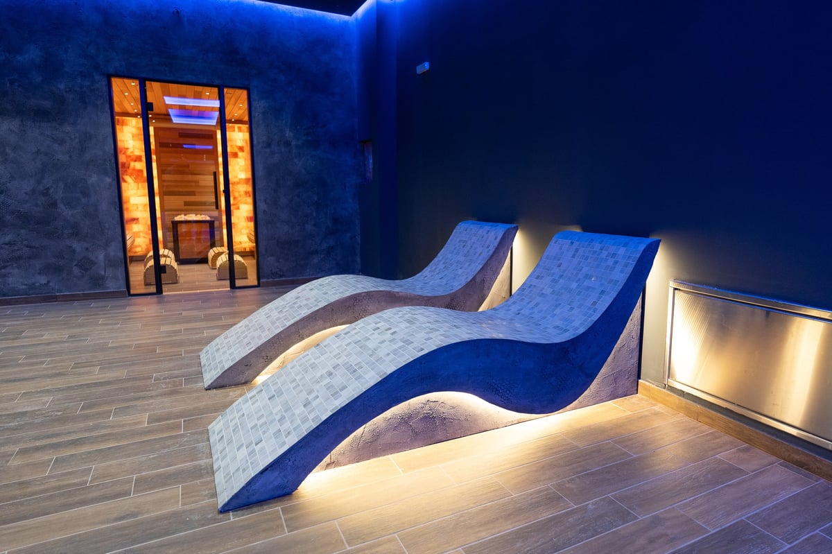 Modern wellness spa with heated loungers and ambient lighting