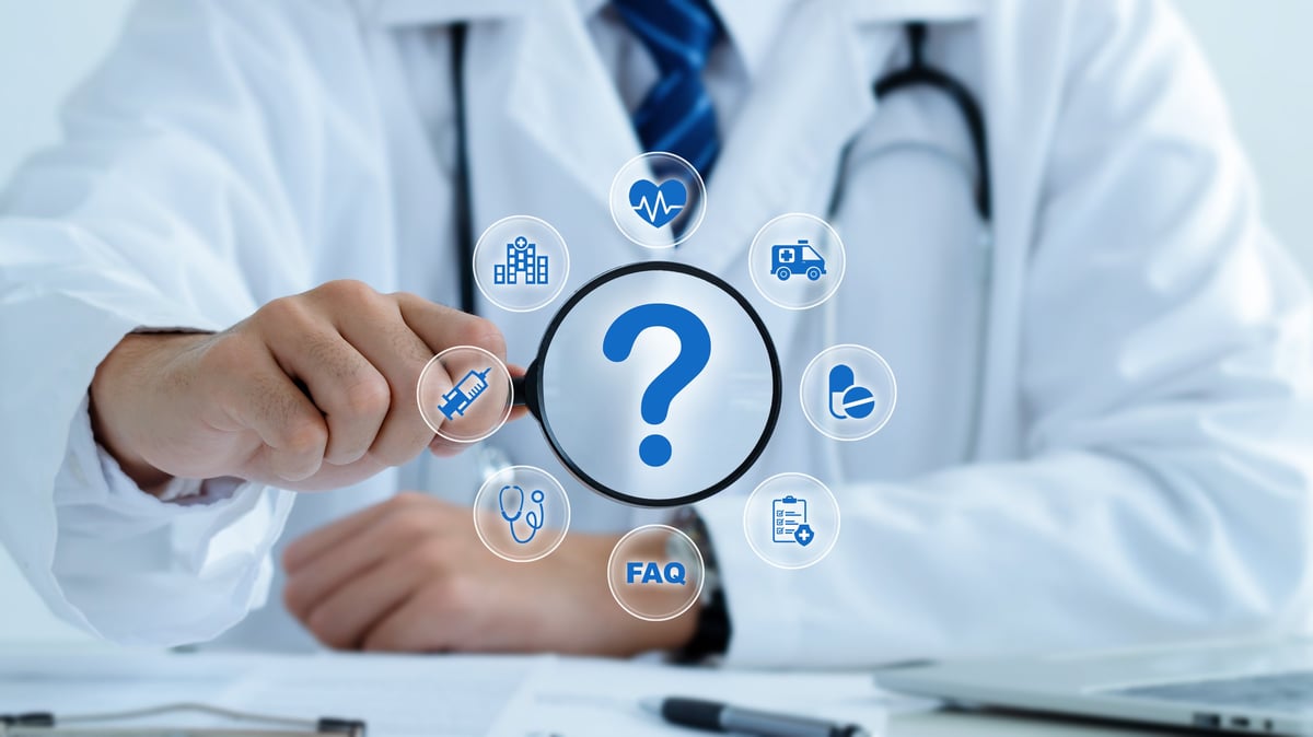 Medical advice, health care confusion and FAQ concept. Doctor with Magnifying glass and question mark.